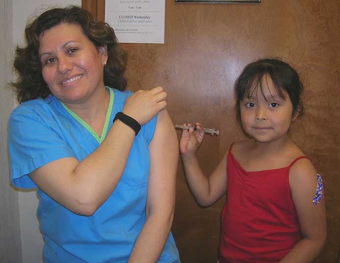 After bravely enduring five injections in one visit, Marleny (right) turns the tables on Gloria.